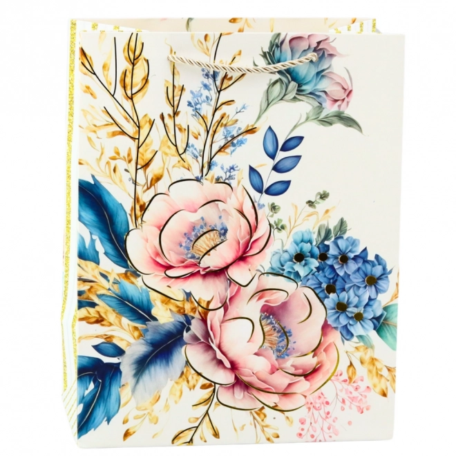 Geschenktasche mit Blumen und goldenen Elementen
