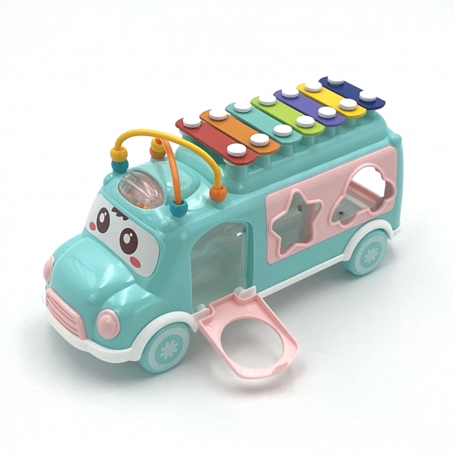 Voiture musicale avec trieur et xylophone vert Woopie