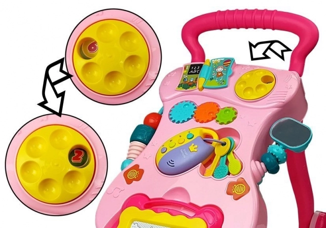 Roze kinderwagen met slinger