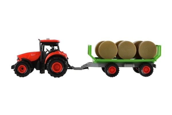Tractor Zetor met aanhanger en plastic balen 36cm op vliegwiel op batterij met licht en geluid in doos 39x13