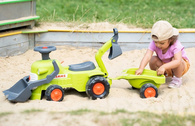 Rijdende tractor Claas met aanhanger, lader en schep