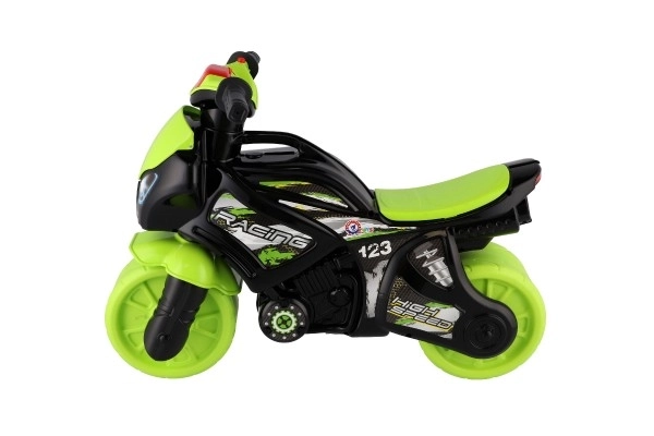 Loopfiets motor groen-zwart plastic op batterij met licht en geluid in zak 36x53x74cm