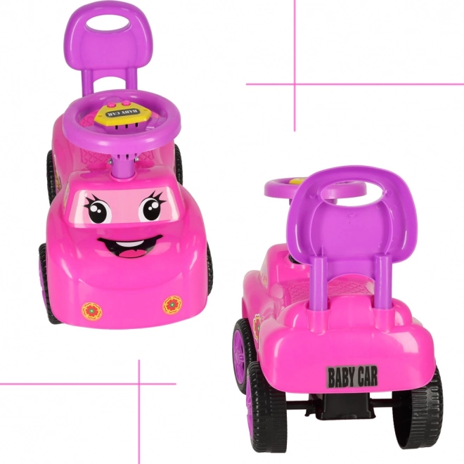 Rutscherläufer lächelnd mit Hupe in Pink