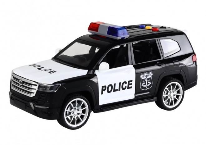 Politiewagen met effecten, open deuren en schaal 1:14
