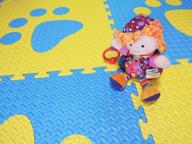 Foam children's rug with blue and yellow paw prints