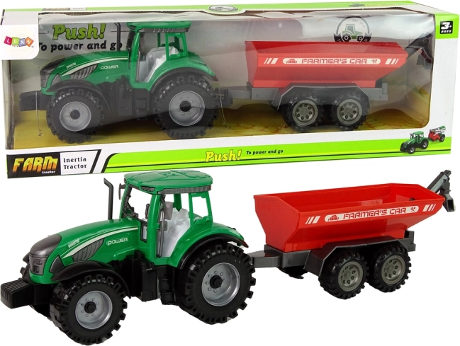 groene tractor met rode aanhanger met vliegwiel