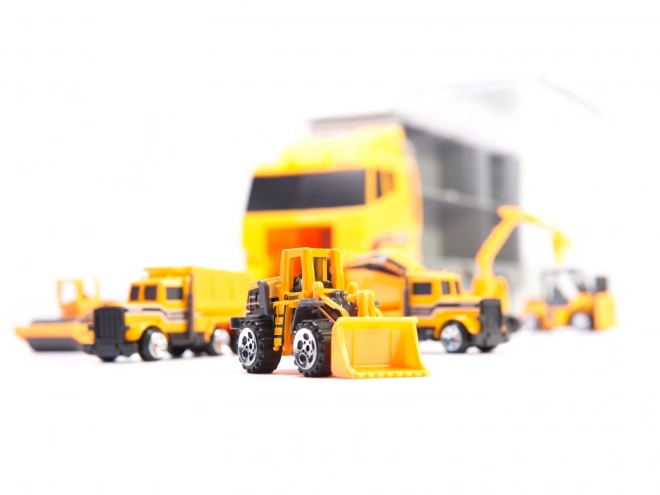 Camion avec petits véhicules de construction