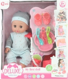 Plaspoppetje met geluiden 28 cm met accessoires