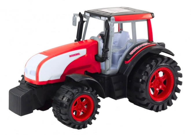 Grand tracteur agricole rouge à entraînement