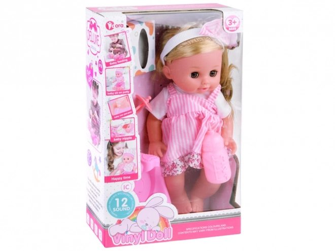 Baby pop met lange haren, praat en huilt
