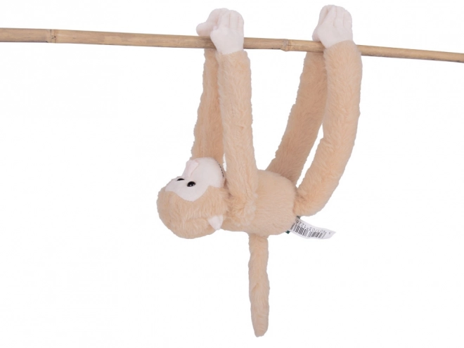 Mascotte singe suspendue de couleur beige