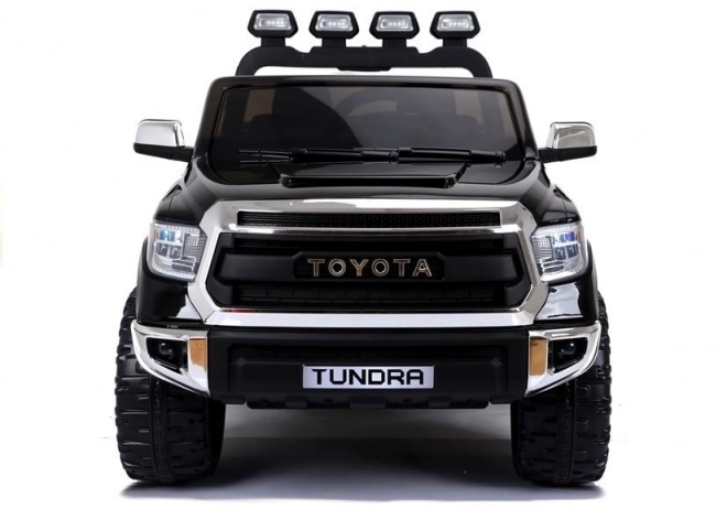 Zwarte elektrische kinderauto Toyota Tundra