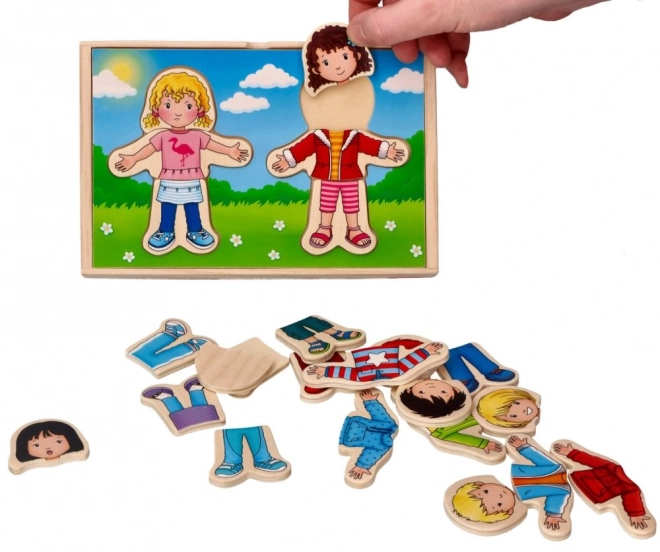 Houten puzzel voor kinderen Kleden met jongen en meisje
