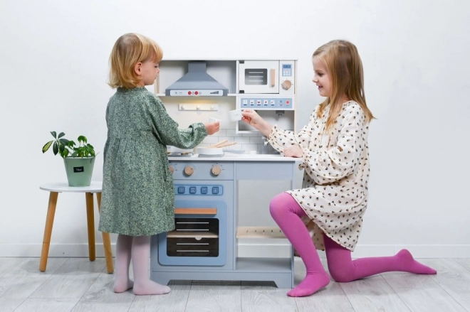 Grote houten interactieve keuken met accessoires