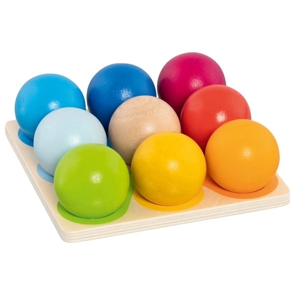 Wooden construction pyramid of colorful marbles