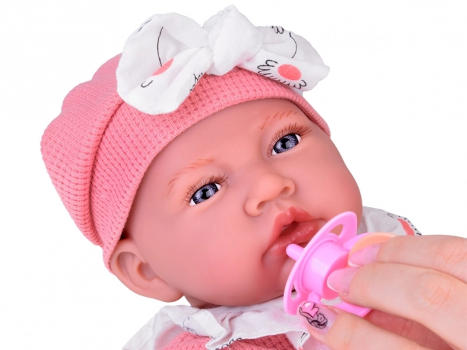 Interactieve pop van 45 cm in roze outfit