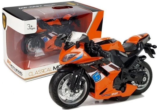 Orange Spielzeugmotorrad mit Antrieb