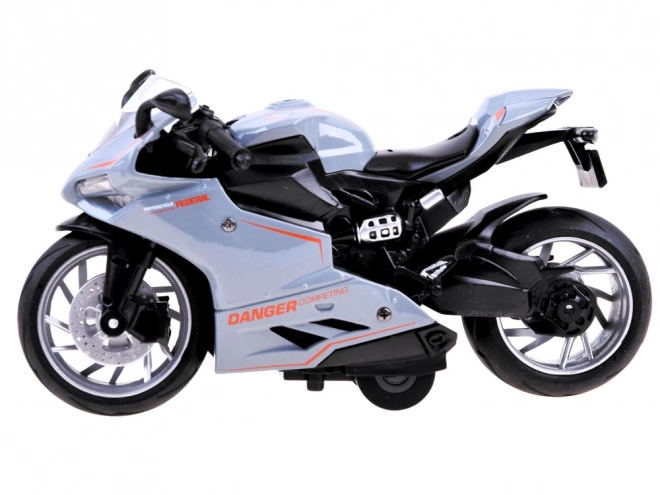 Metalen motorfietsmodel met opwindmechanisme – A