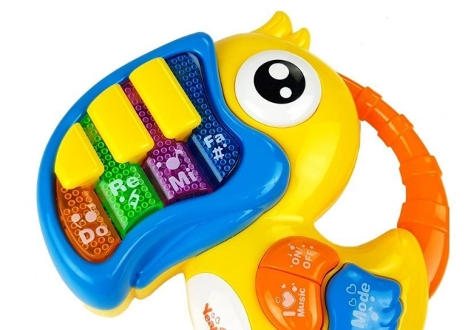 Interaktives Spielzeug Klavier und Gitarre Papagei und Fisch