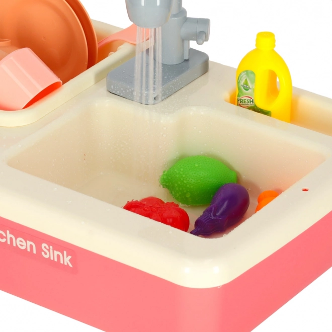 Kinderkeuken gootsteen met echt water en roze accessoires