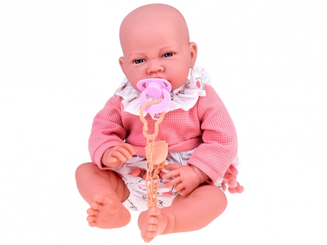 Interactieve pop van 45 cm in roze outfit