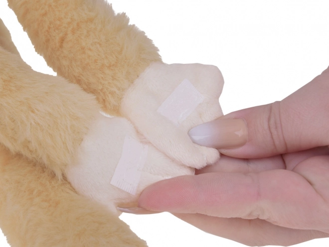 Mascotte singe suspendue de couleur beige