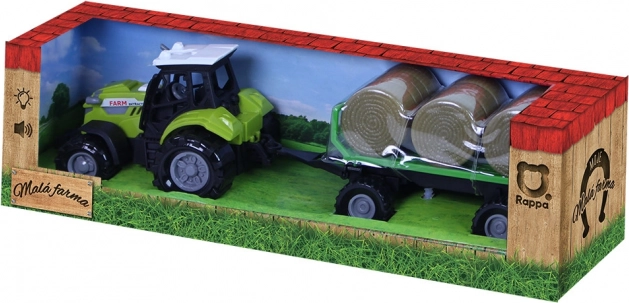 Tractor with sound and light with trailer and straw bales