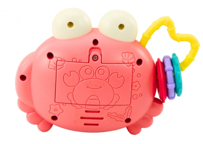 Roze interactieve krab met projector en rammelaar op batterijen