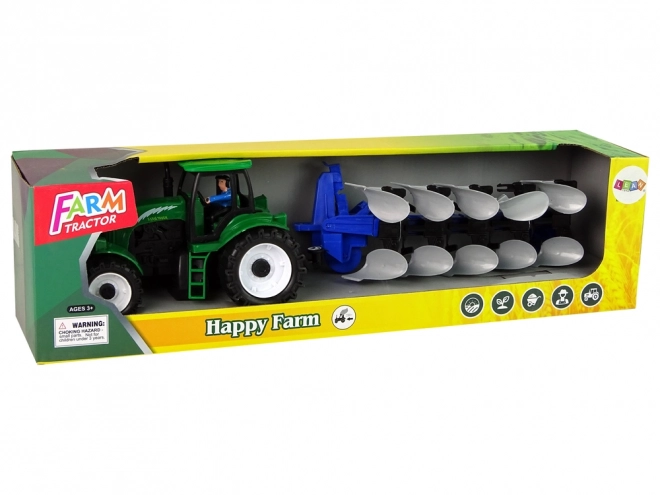 Groene landbouwtractor met ploeg