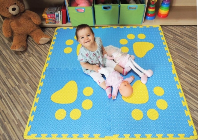 Foam children's rug with blue and yellow paw prints