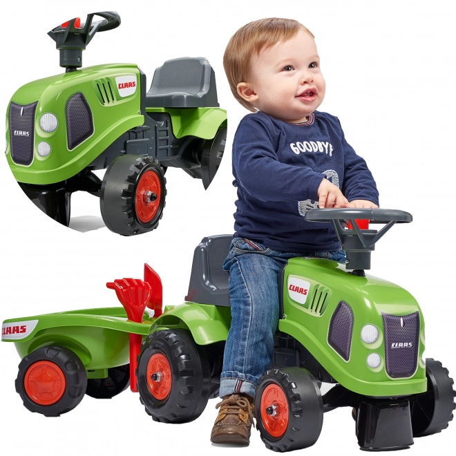Duwtractor Claas groen met stuur en aanhanger