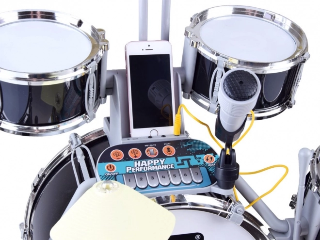 Children's drum set with microphone and music panel