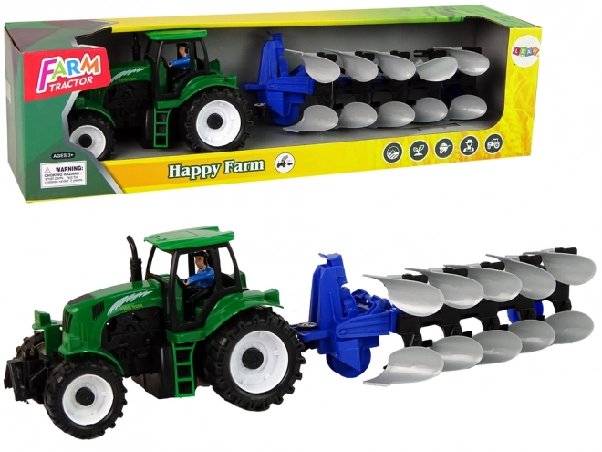 Groene landbouwtractor met ploeg