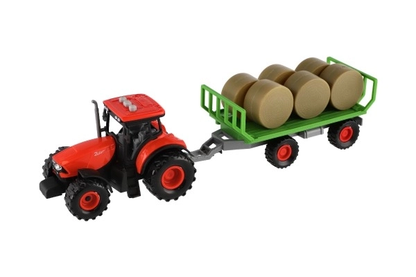 Tractor Zetor met aanhanger en plastic balen 36cm op vliegwiel op batterij met licht en geluid in doos 39x13