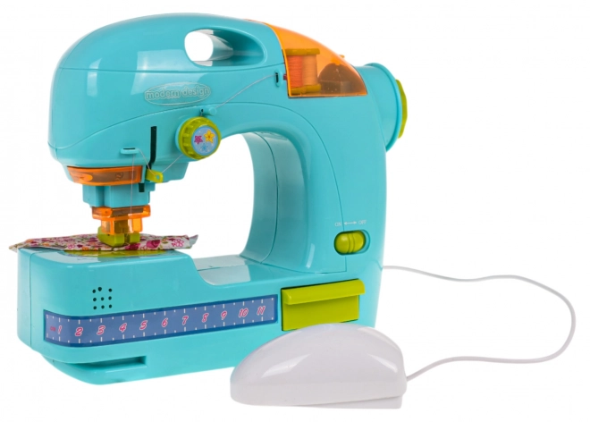 Blauwe naaimachine + accessoires