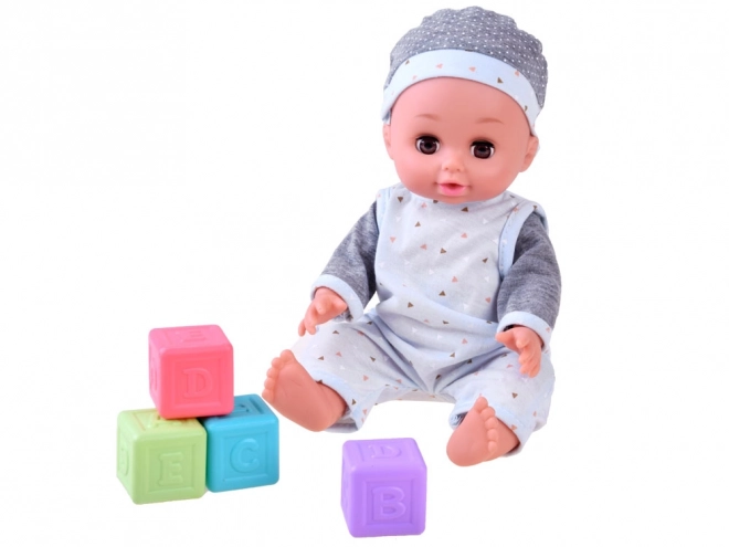 Interactieve pop baby drinkt plast en praat