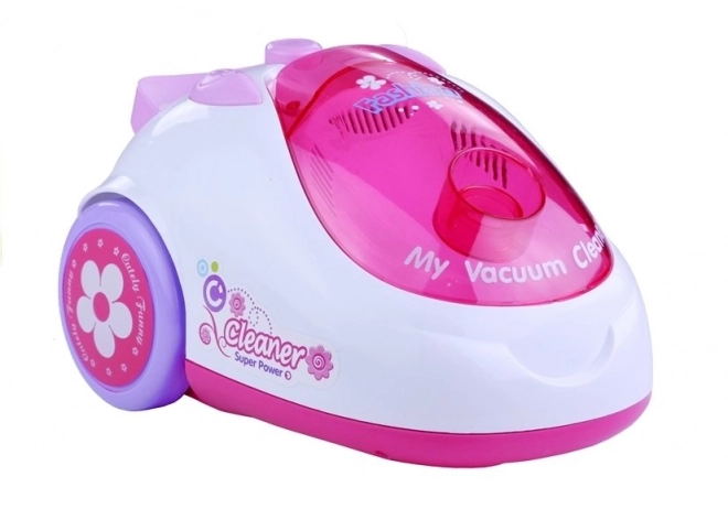 Roze kinderstofzuiger op batterijen met twee opzetstukken