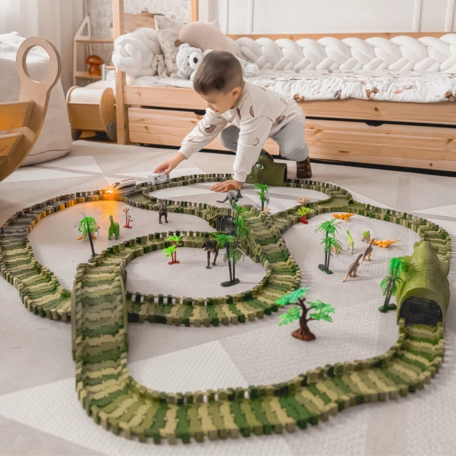 Piste de course de dinosaures avec petite voiture et figurines