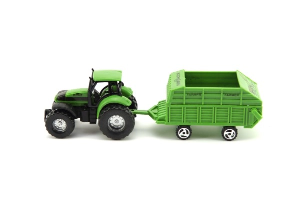 Groene tractor met realistische aanhangwagen