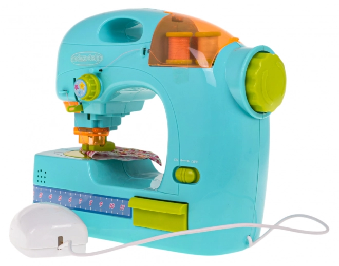 Blauwe naaimachine + accessoires