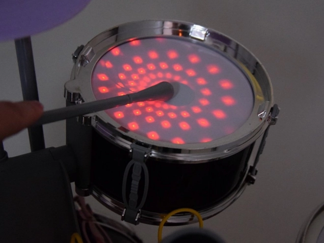 Children's drum set with microphone and music panel