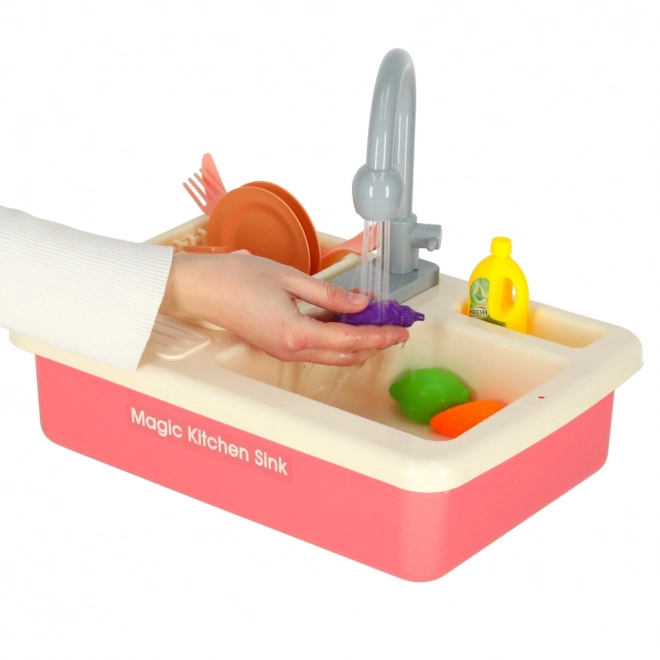 Kinderkeuken gootsteen met echt water en roze accessoires