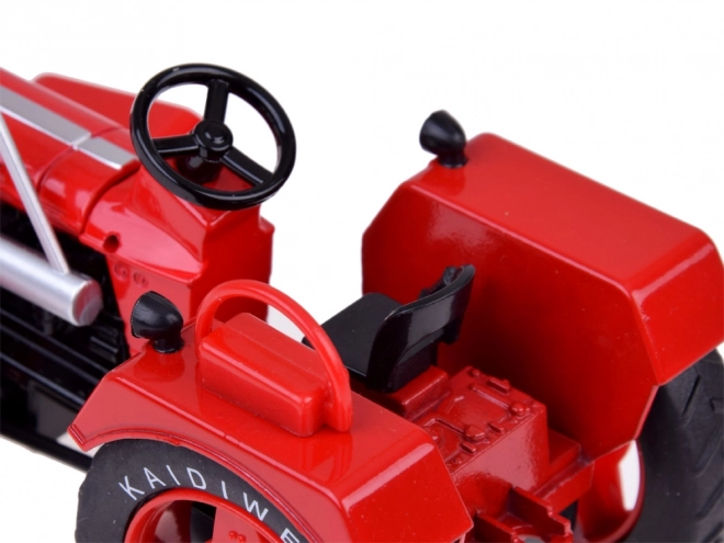 Rode metalen tractor met rubberen wielen 1:18