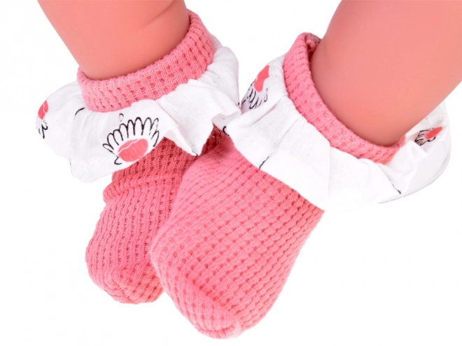 Interactieve pop van 45 cm in roze outfit