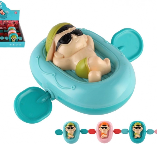 Wind-up little swimmer on a float for water, plastic, 13 × 9 cm, 4 colors