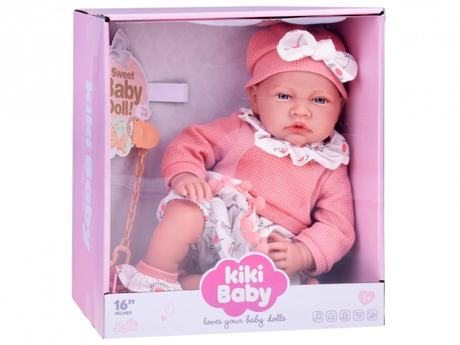 Interactieve pop van 45 cm in roze outfit