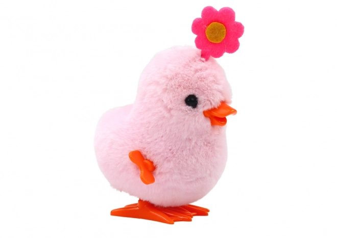 Roze springende kuikentje op een sleutel