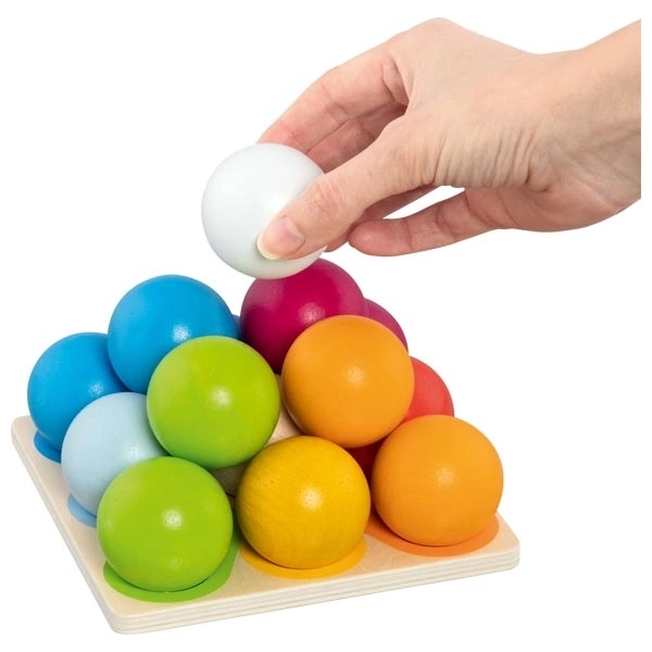 Wooden construction pyramid of colorful marbles
