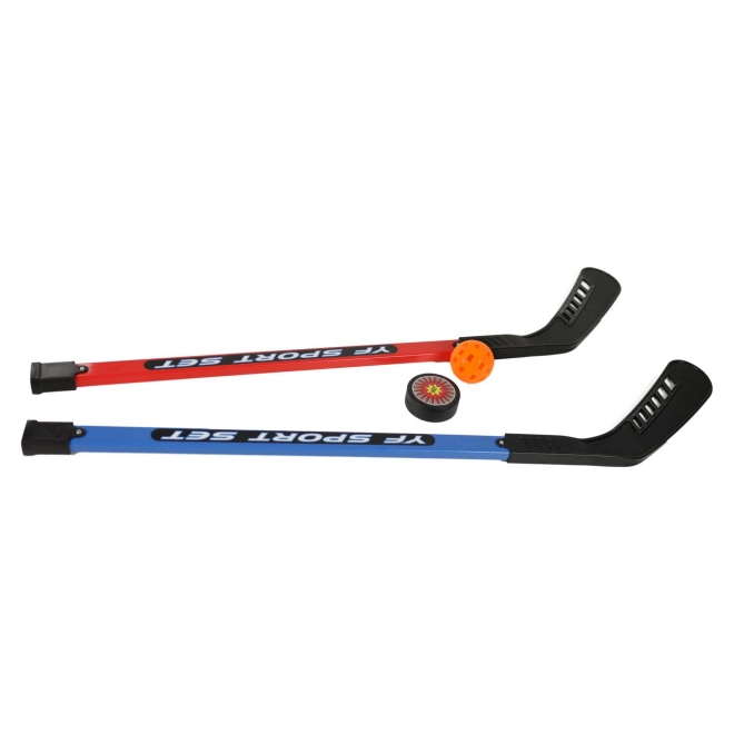 Hockeysticks met bal en puck