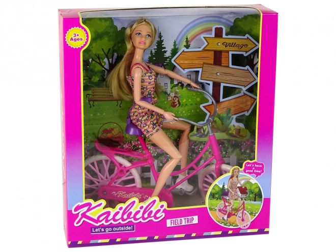 Pop op een roze fiets